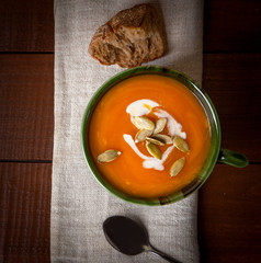 Pumpkin soup on wooden