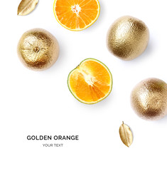 Creative layout made of gold orange fruit.  Tropical flat lay. Food concept.