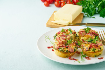 Egg muffin baked with bacon and tomato, ketogenic keto diet, pastel modern closeup copy space