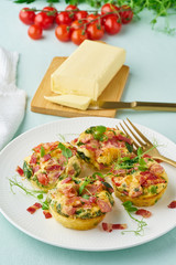 Egg muffin baked with bacon and tomato, ketogenic keto diet, pastel modern closeup vertical