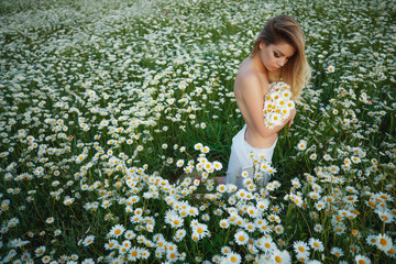 Tender woman in flowers.