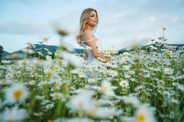 Tender woman in flowers.