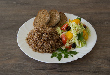 Buckwheat salad with cabbage,  peppers, black olives