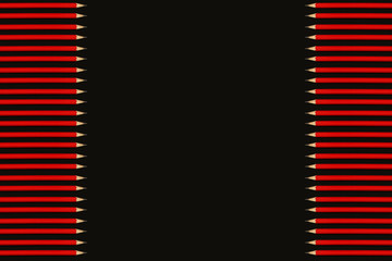 red pencils on a black background. Back to school concept, top view, copy space