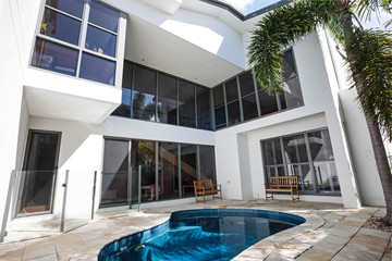 Swimming pool with pool stools.