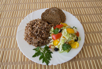 Buckwheat salad with cabbage,  peppers, black olives