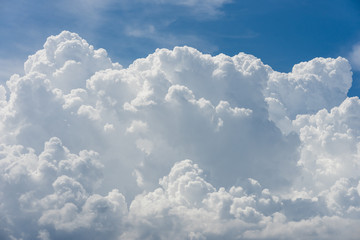 Naklejka na ściany i meble vivid immense white cloud with blue sky background