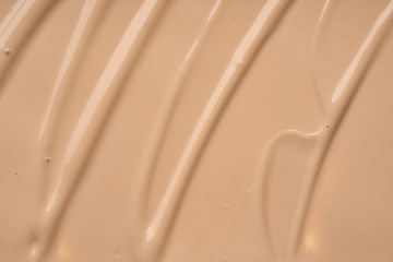 Gently beige strokes and texture of concealer