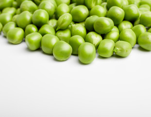 Fresh green pea pod with beans isolated on white background.