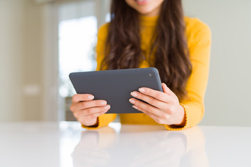 Beautiful young woman working using touchpad tablet