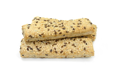 Breadsticks or grissini with sesame and linseed isolated on white background. Salt cracker isolated.