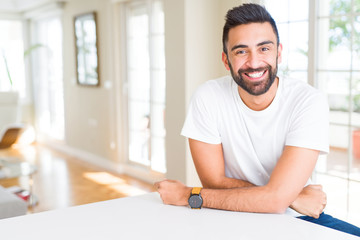 Fototapeta premium Handsome man smiling cheerful with a big smile on face showing teeth, positive and happy expression