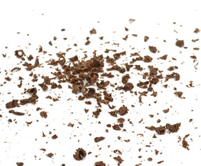 Grated chocolate. Heap of ground chocolate isolated on white background with clipping path, closeup.