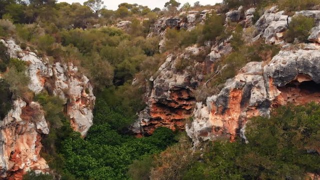 Aerial of a wild natural rocky gorge canyon in the middle of nature. Spain Palma de Mallorca