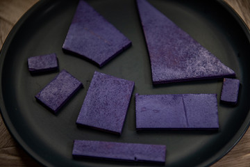 purple wood on black plate
