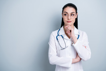 Close up photo beautiful amazing she her lady young doctor first working day hospital look empty space listen colleagues wear phonendoscope white science costume specs isolated grey background