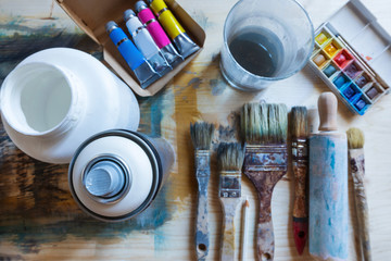 Spray can and tools of artist on the table