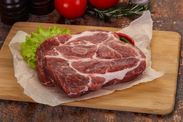 Raw pork neck steak