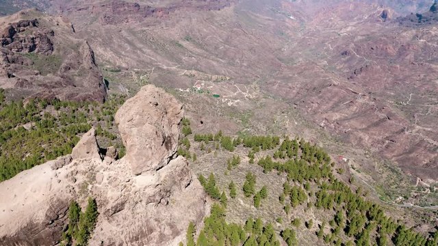 Panoramic aerial view of Roque Nublo (close approximation from the north), emblematic place of the island of Gran Canaria (Spain, Europe).