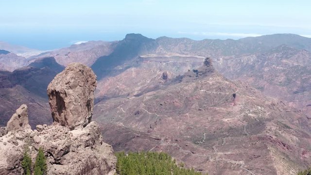 Panoramic aerial view of Roque Nublo (close approximation from the north), emblematic place of the island of Gran Canaria (Spain, Europe).