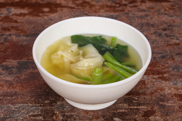 Asian traditional Wonton soup with herbs