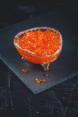 Salmon caviar in glass plate