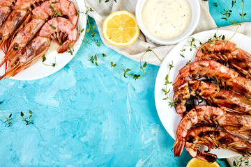 Grilled big tiger shrimps prawns on white plate