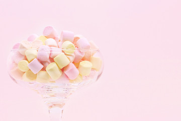 Marmellow air marshmallow close-up on a pink background, pastel colors, light dessert, place for text