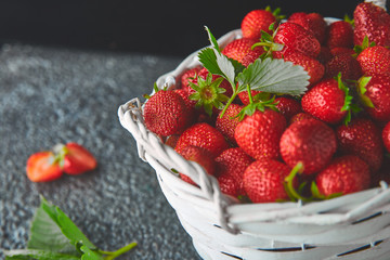 Strawberries in white basket. Fresh strawberries. Beautiful strawberries.