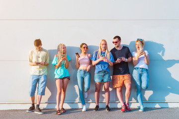 Group of young people using their mobile phones