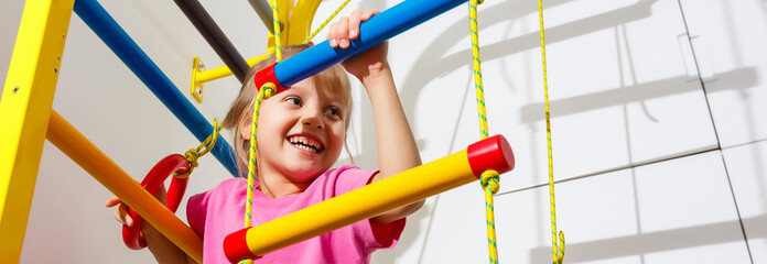 8 years old child playing on sports equipment