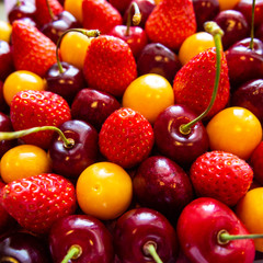background of fresh cherries, strawberries and physalis