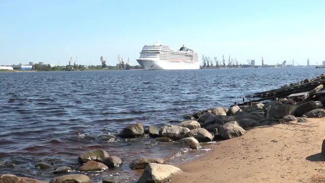 perfect view of wavy river with approaching large white cruise liner against clear blue sky on sunny day