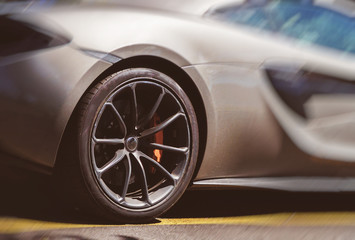 Close-up view of sports car wheel.