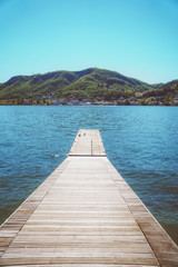 Pier on the beautiful summer Como lake in Italy.