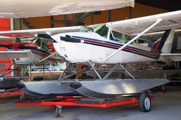 Close-up view of floatplanes (seaplanes) standing in hangar.