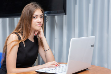 Happy Young Beautiful Woman Using Laptop, Indoors