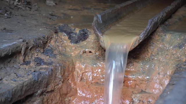 Water flows from the gutter. Drainage system in sewer tunnel, underground river canalization
