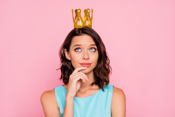 Close up photo beautiful she her lady attractive appearance look dreamy empty space hand arm finger chin golden headwear famous person wear colorful blue dress isolated pink bright background © deagreez