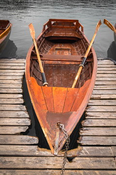 scenic view on beautiful wooden flat rowing boats on lake bled, slovenia, go green concept