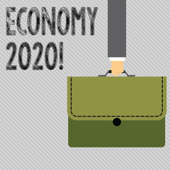 Text sign showing Economy 2020. Conceptual photo state of country in terms of production and consumption goods Businessman Hand Carrying Colorful Briefcase Portfolio with Stitch Applique.