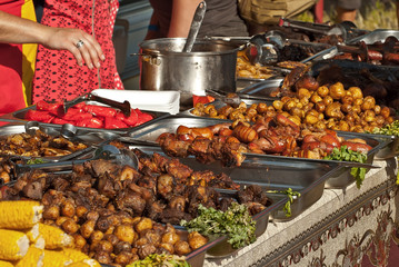 Different types of fried meat on the table. BBQ at the festival.