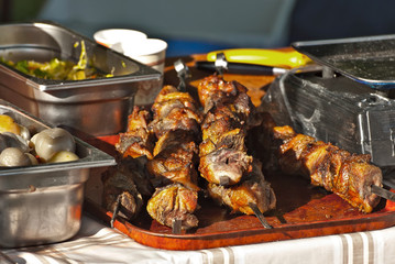 Different types of fried meat on the table. BBQ at the festival.
