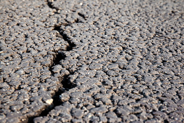 close up of a crack on a new asphalt