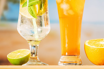 Fresh juicy drinks and sliced lime orange