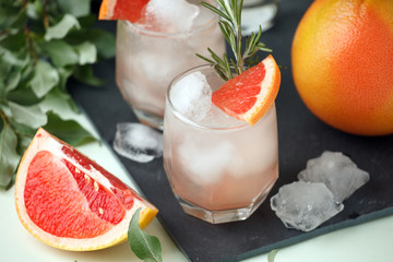 Grapefruit and rosemary gin cocktail, refreshing drink with ice, summer time, resort bar cart menu concept