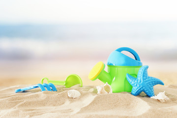 vacation and summer image with beach colorful toys for kid over the sand