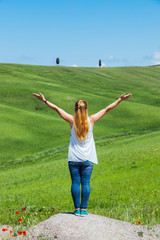 Obraz premium Young woman traveling through Tuscany, Italy