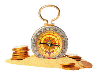 compass on the sea sand and place for text