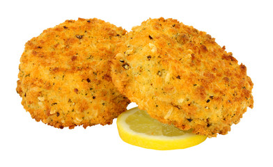 Breadcrumb covered salmon fish cakes isolated on a white background